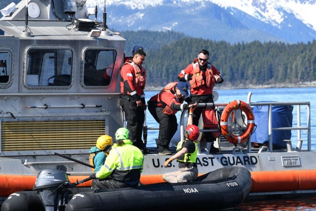 Aboard their vessel US Coast Guard Station Juneau crew members provide safety and communications support to the response team keeping the area secure and directing passing mariners during the response effort Credit Alaska Department of Fish and GameJamie Musbach NOAA Fisheries Permit  24359